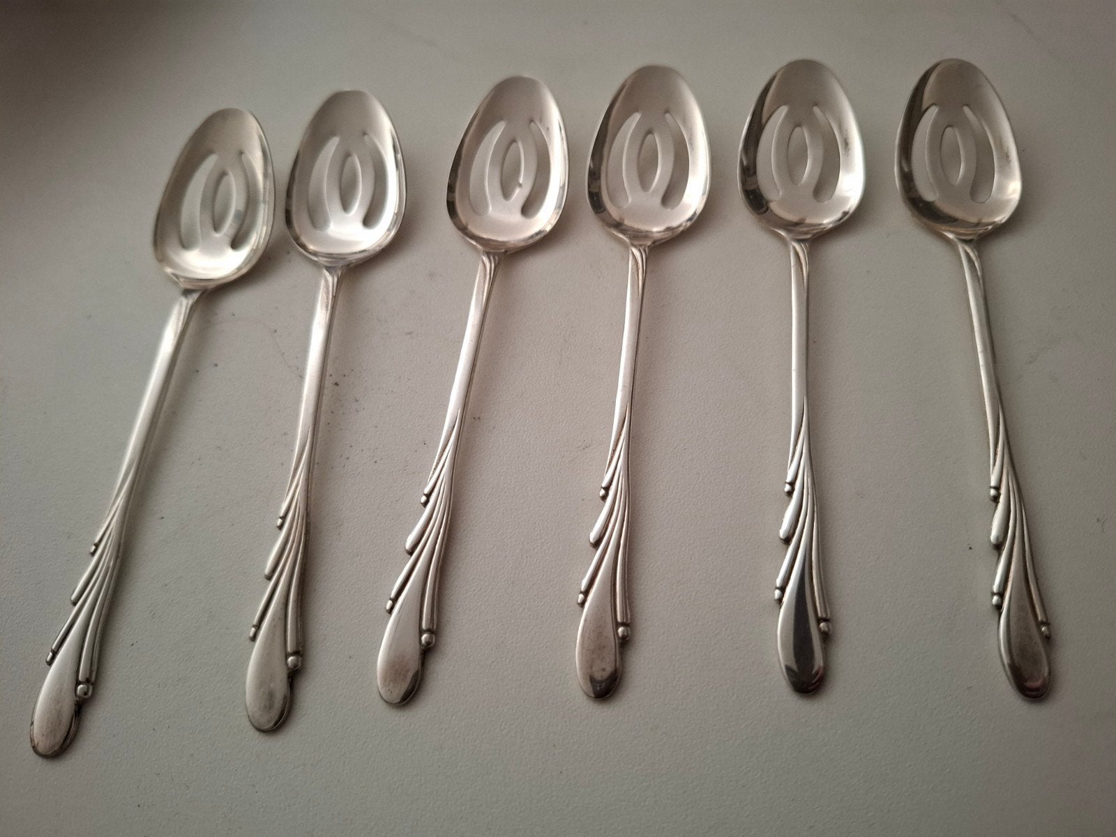 6 olijflepeltjes van de Melk-Unie, verzilverd, Ophalen of Verzenden