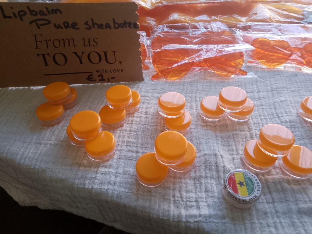Orange zonnebrillen, shea boter en armbandjes, Ophalen of Verzenden