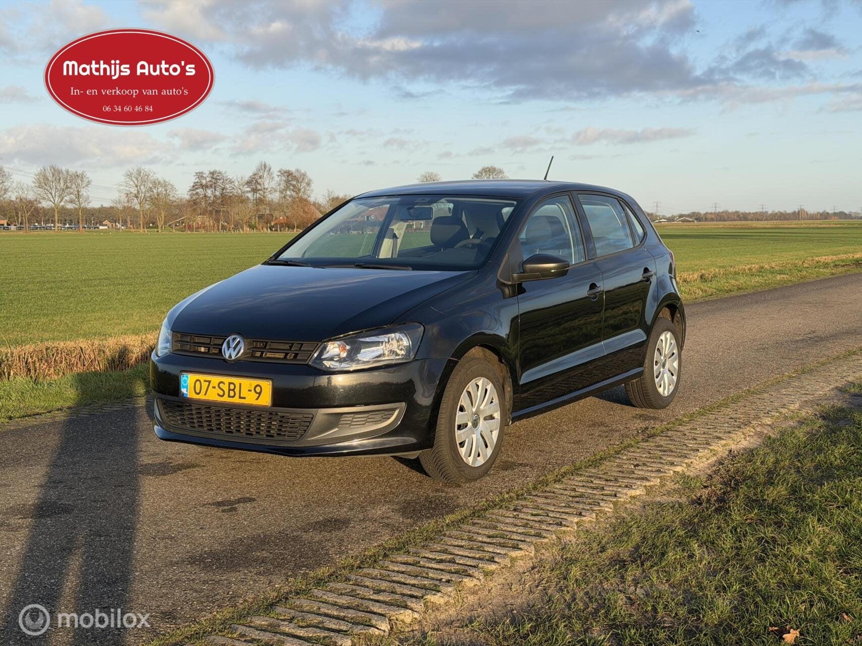 Volkswagen Polo 1.6 TDI Comfortline, Auto's, Voorwielaandrijving, Euro 5, Verwarmde buitenspiegels, Zwart