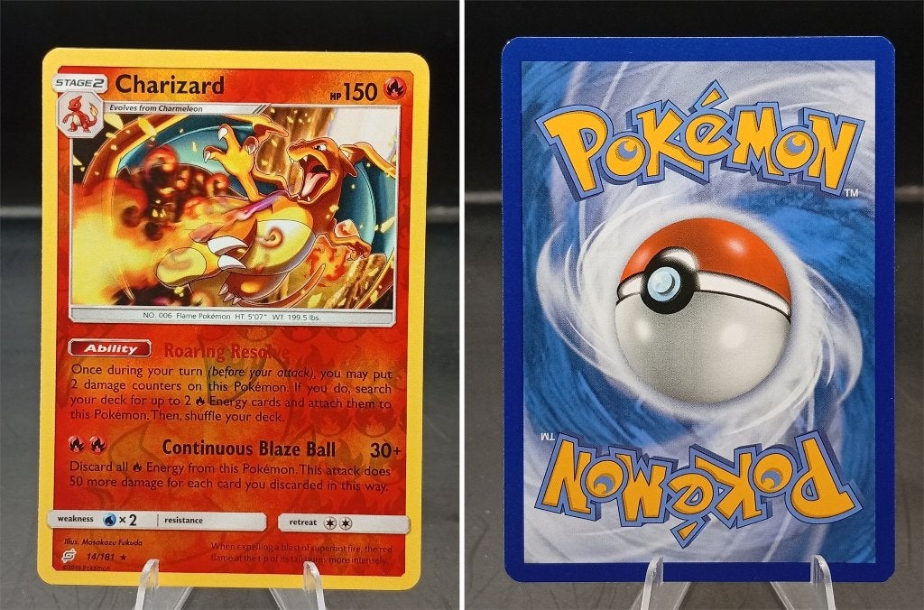 Charizard Team Up (TEU 14) Reverse holo - Near Mint, Ophalen of Verzenden, Zo goed als nieuw, Losse kaart