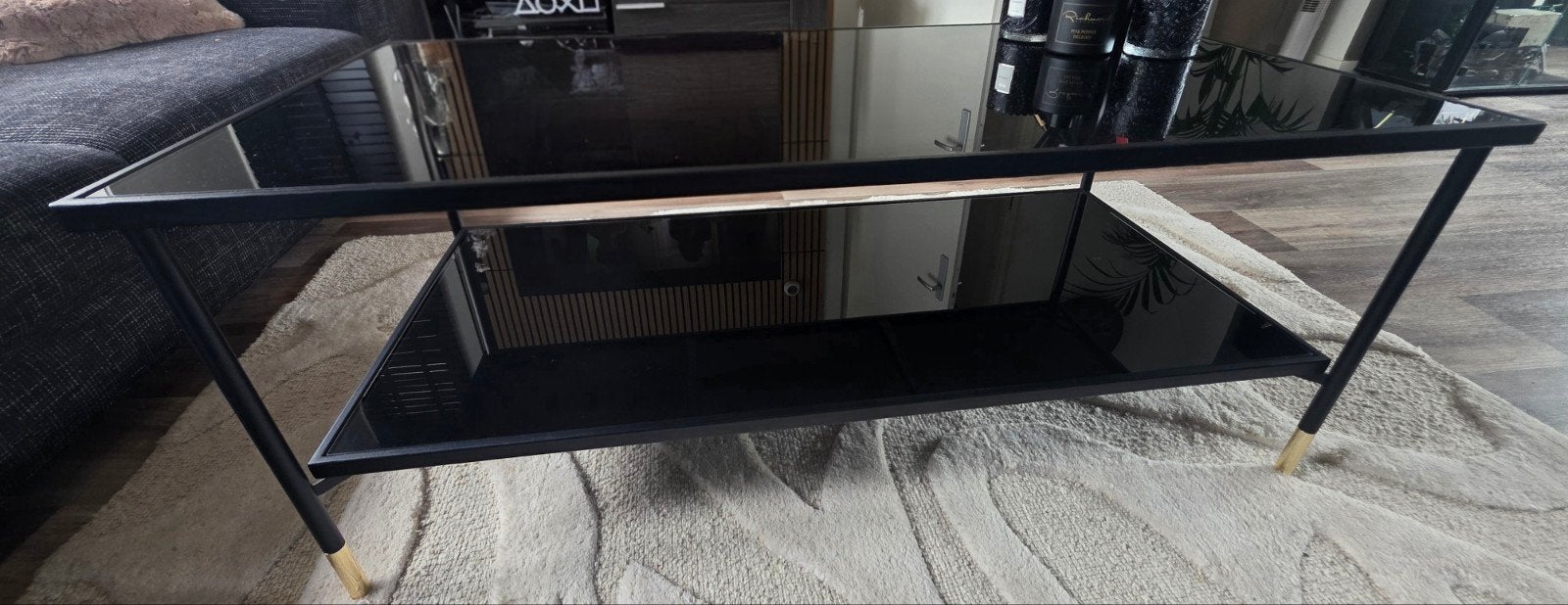 Zwarte salontafel met glazen blad en metalen onderstel, Huis en Inrichting, Tafels | Salontafels, Ophalen, Gebruikt, 50 tot 100 cm