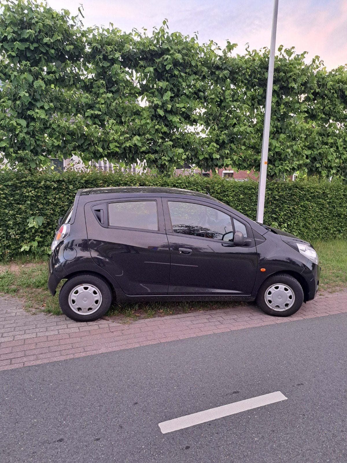Chevrolet Spark 1.0 Benzine 2010 Zwart, Auto's, Voorwielaandrijving, 839 kg, Stof, Zwart