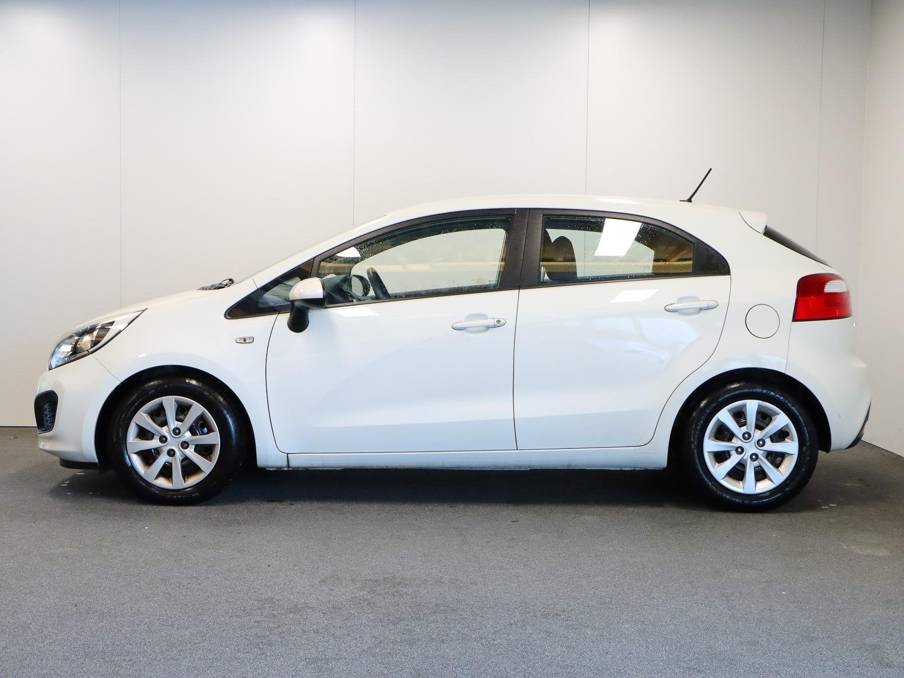 Kia Rio 1.2 CVVT Comfort Pack, Auto's, 4 cilinders, Elektrische ramen, Wit, Origineel Nederlands