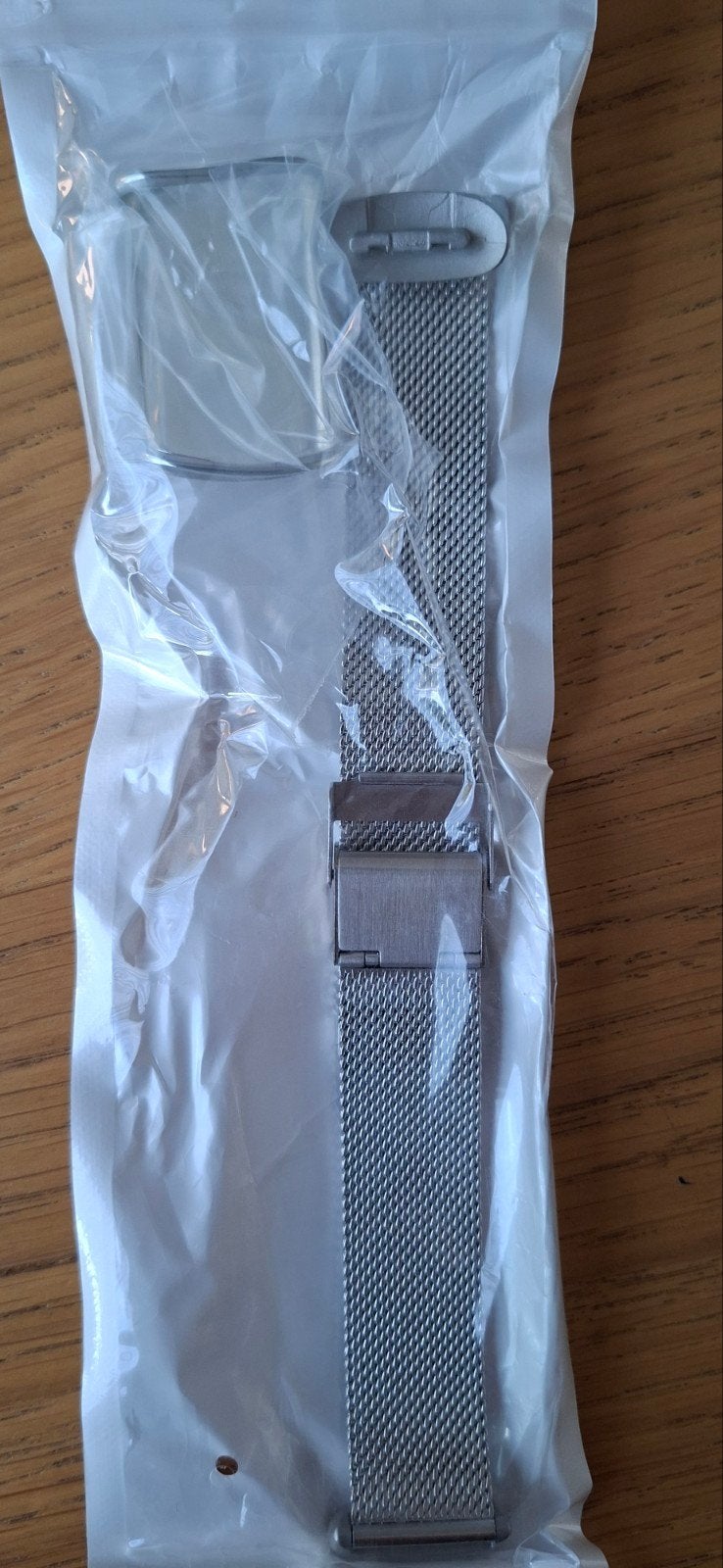 Nieuw  zilverkleurig fitbit bandje, Ophalen of Verzenden, Nieuw, Zilver, Android