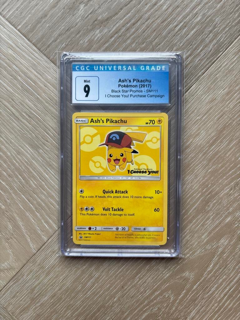 CGC 9 Ash’s Pikachu – SM111 Black Star Promo, Ophalen of Verzenden, Zo goed als nieuw, Losse kaart