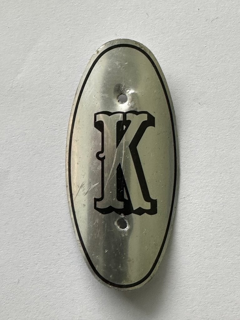 Balhoofdplaatje "K" Kopra rijwiel balhoofd plaatje., Gebruikt, K., Overige typen, Ophalen of Verzenden