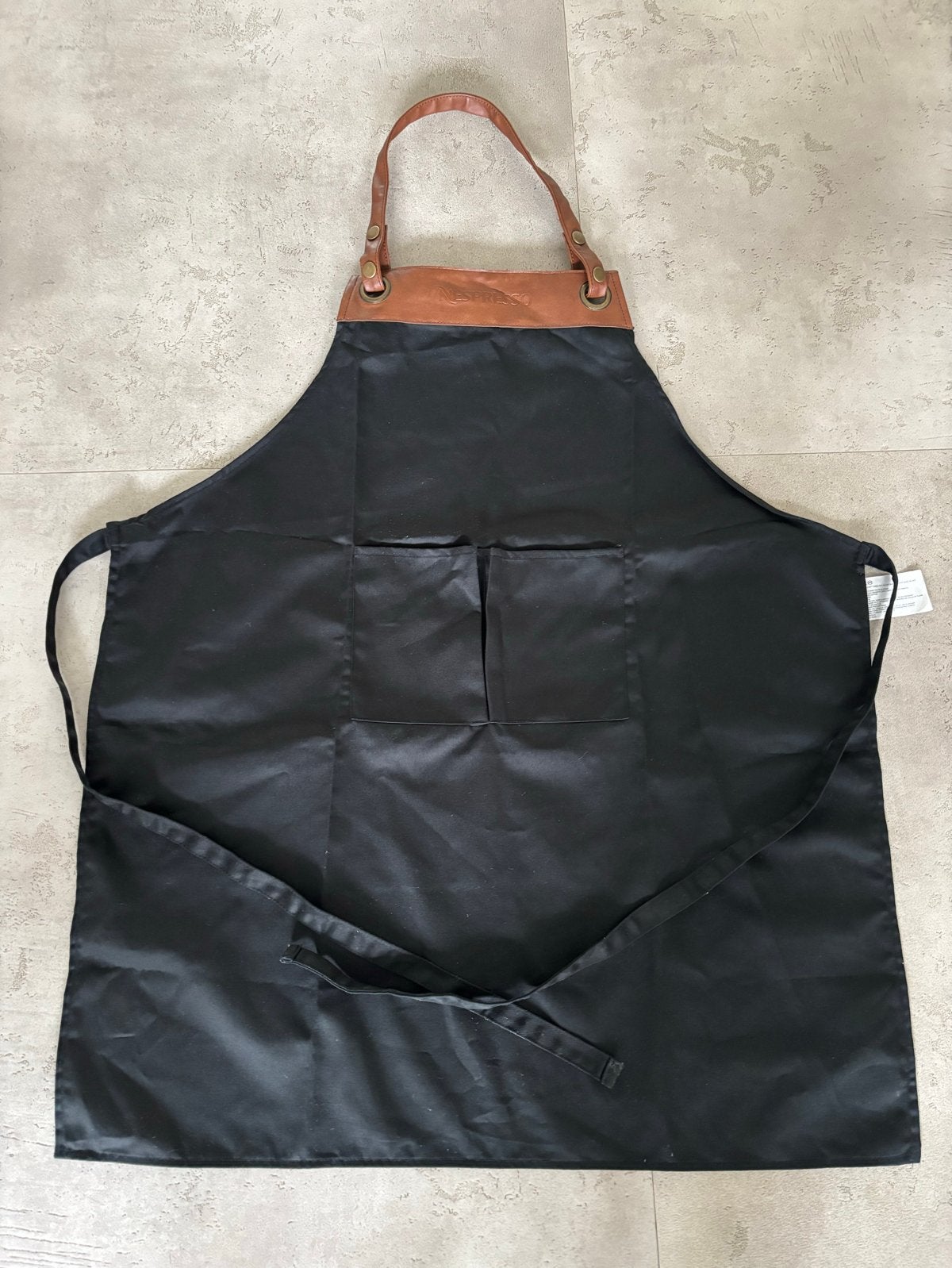 Nespresso Schort zwart - Nieuw met cognac Leren Details, Overige typen, Nieuw, Ophalen of Verzenden, Natuurlijk materiaal