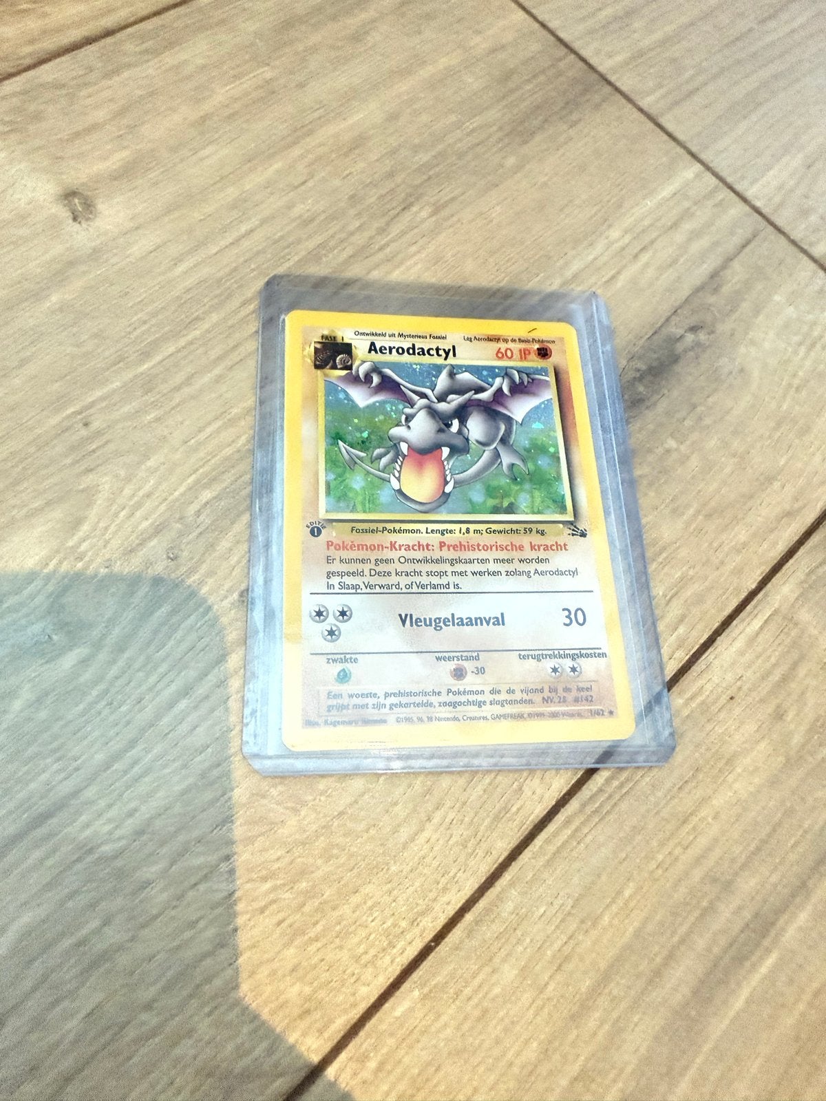 Aerodactyl #1 1st editie Pokémon kaart, Hobby en Vrije tijd, Verzamelkaartspellen | Pokémon, Ophalen of Verzenden, Gebruikt, Losse kaart