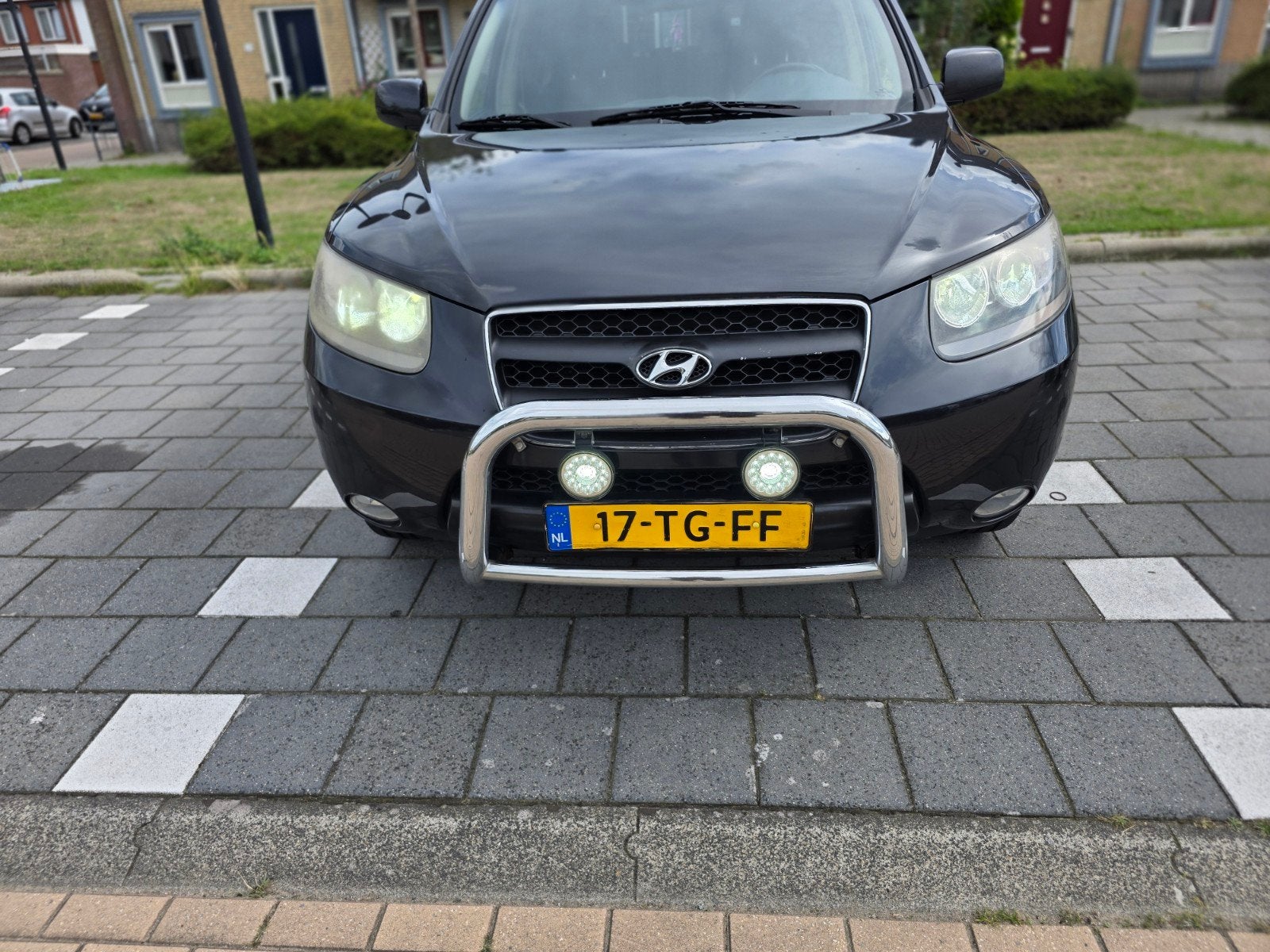 Hyundai Santa Fe 2.7 2WD 7-ST 2006 Zwart, Auto's, Voorwielaandrijving, Santa Fe, Beige, 2000 kg