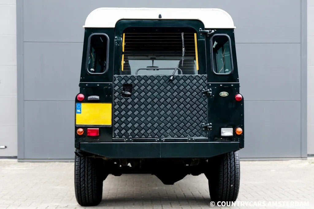 Land Rover Defender 2.5 110 Country, Auto's, Stof, Gebruikt, Zwart, 4 cilinders