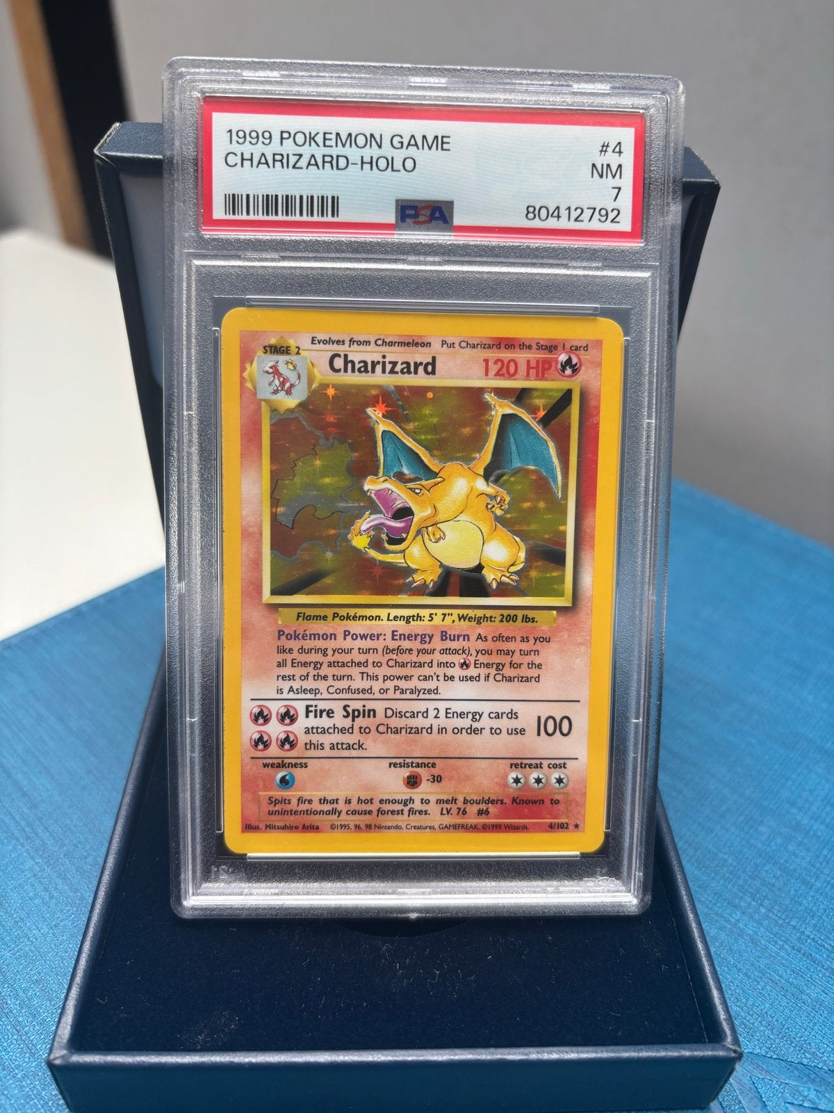 Charizard PSA 7 - base set unlimited, Hobby en Vrije tijd, Ophalen of Verzenden, Gebruikt, Losse kaart, Foil