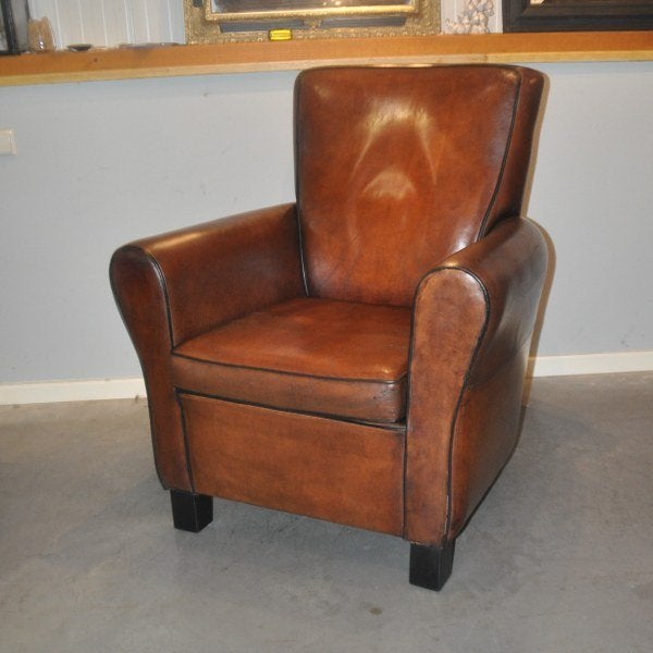 Hoge schapenleren fauteuil van Lounge Atelier, Gebruikt, Ophalen of Verzenden, 50 tot 75 cm, Leer