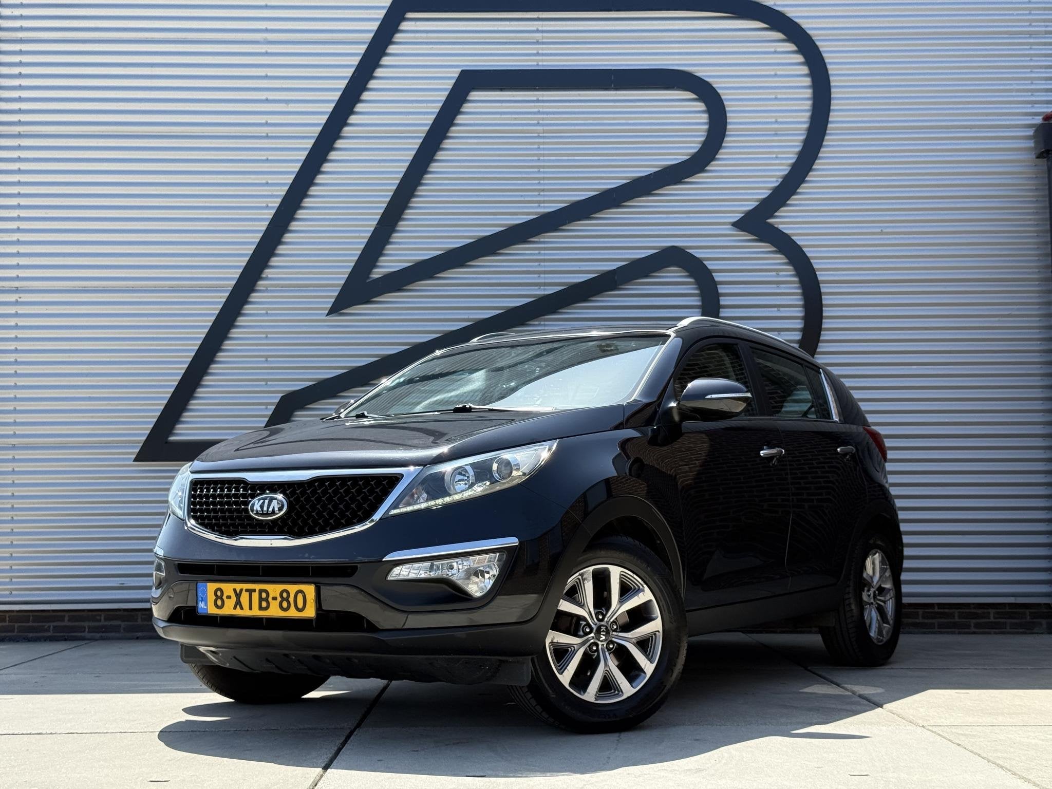 Kia Sportage 1.6 GDI BusinessLine 1e Eigenaar|Navi|Camera|Cl, Auto's, Voorwielaandrijving, Euro 5, 1591 cc, Zwart