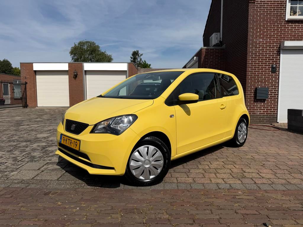 Seat Mii 1.0 Style 55KW 2012 Geel APK 4-2-2027 / Airco, Auto's, Seat, Euro 5, Stof, 74 pk, 4 stoelen