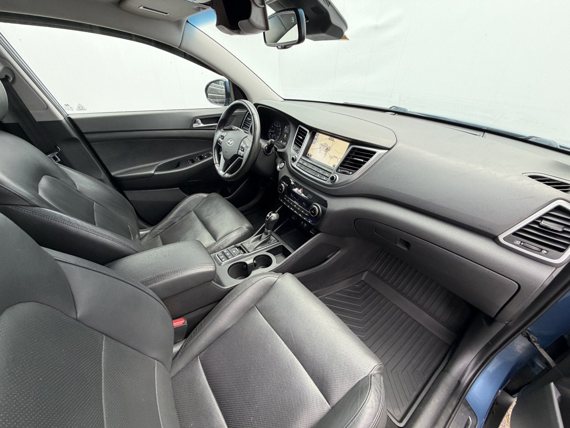 Hyundai Tucson 1.6 T-GDi Premium 4WD Pano Trekhaak StoelVerw, Auto's, Lichtsensor, Gebruikt, 4 cilinders, Blauw