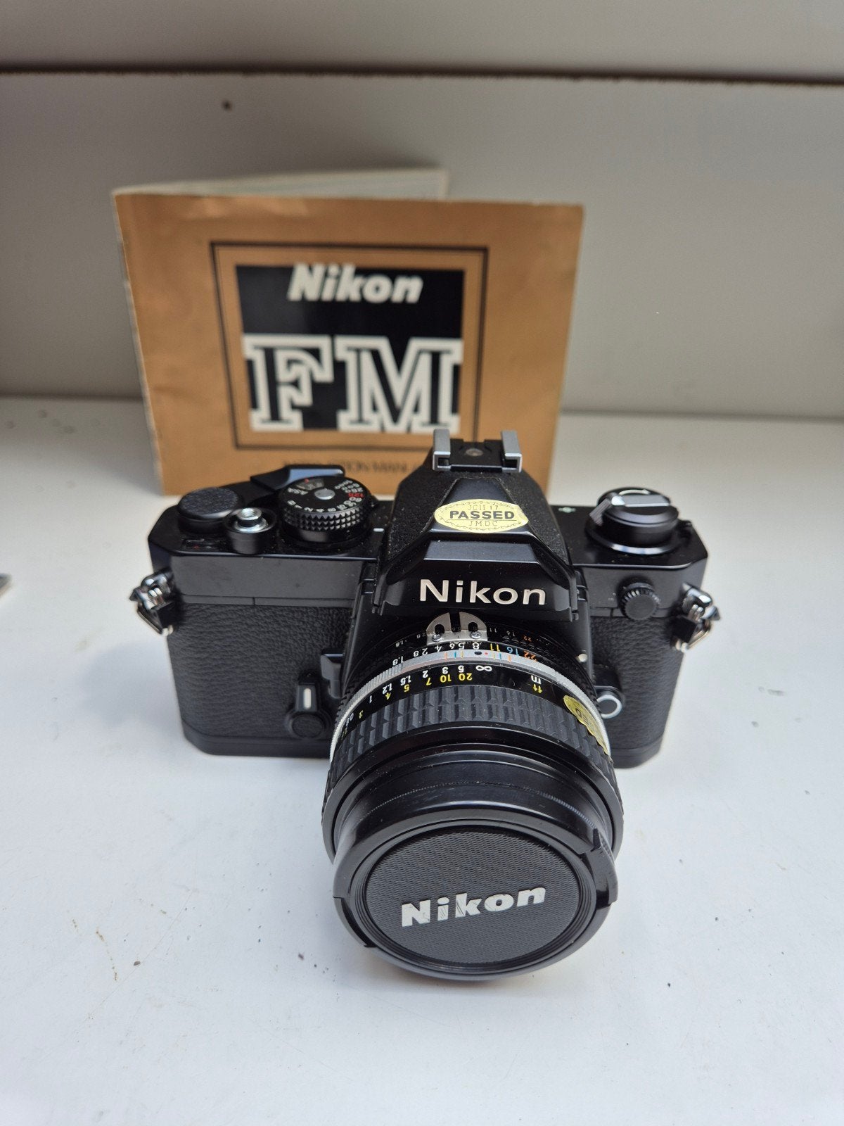 Nikon FM Spiegelreflexcamera met Nikkor 50mm f/1.8 lens, Ophalen of Verzenden, Gebruikt, Spiegelreflex, Nikon
