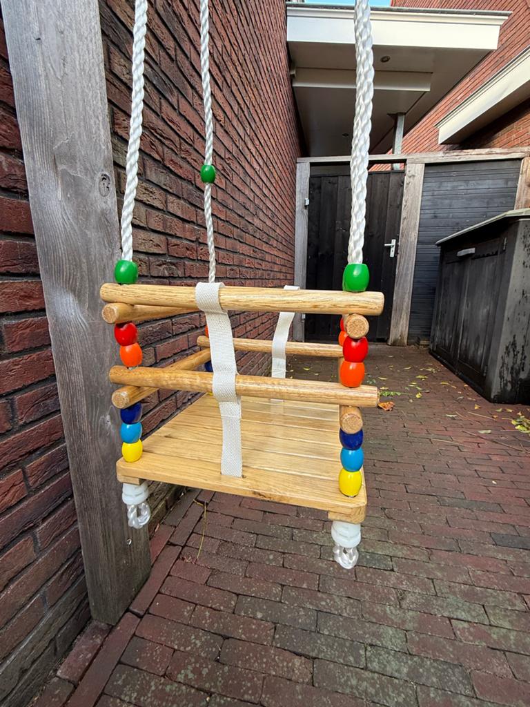 Houten babyschommel - weinig gebruikt, Kinderen en Baby's, Speelgoed | Buiten | Speeltoestellen, Ophalen of Verzenden, Zo goed als nieuw