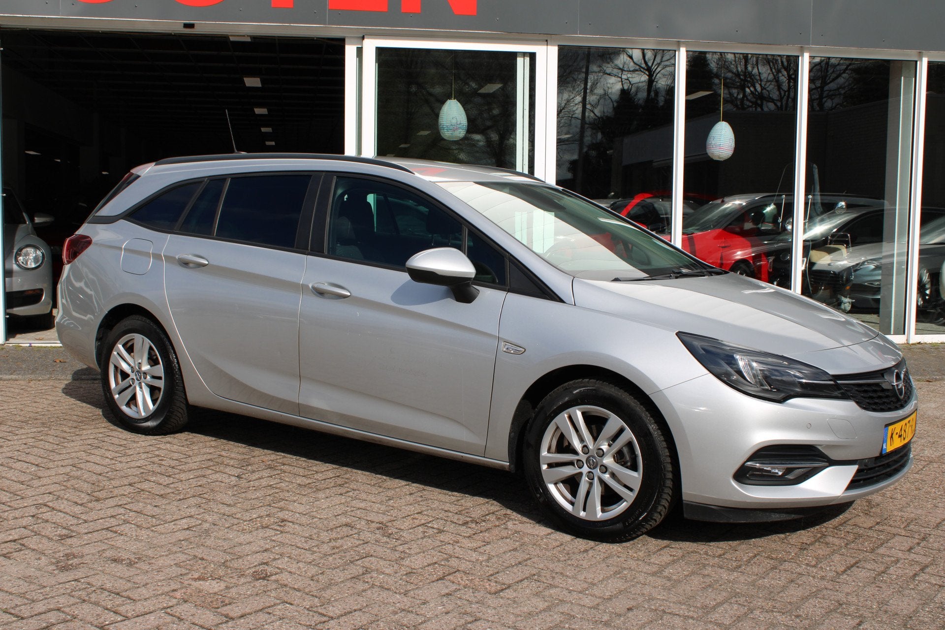 Opel Astra Sports Tourer 1.2 Business Edition (bj 2021), Auto's, Voorwielaandrijving, Dealer onderhouden, Stof, Gebruikt
