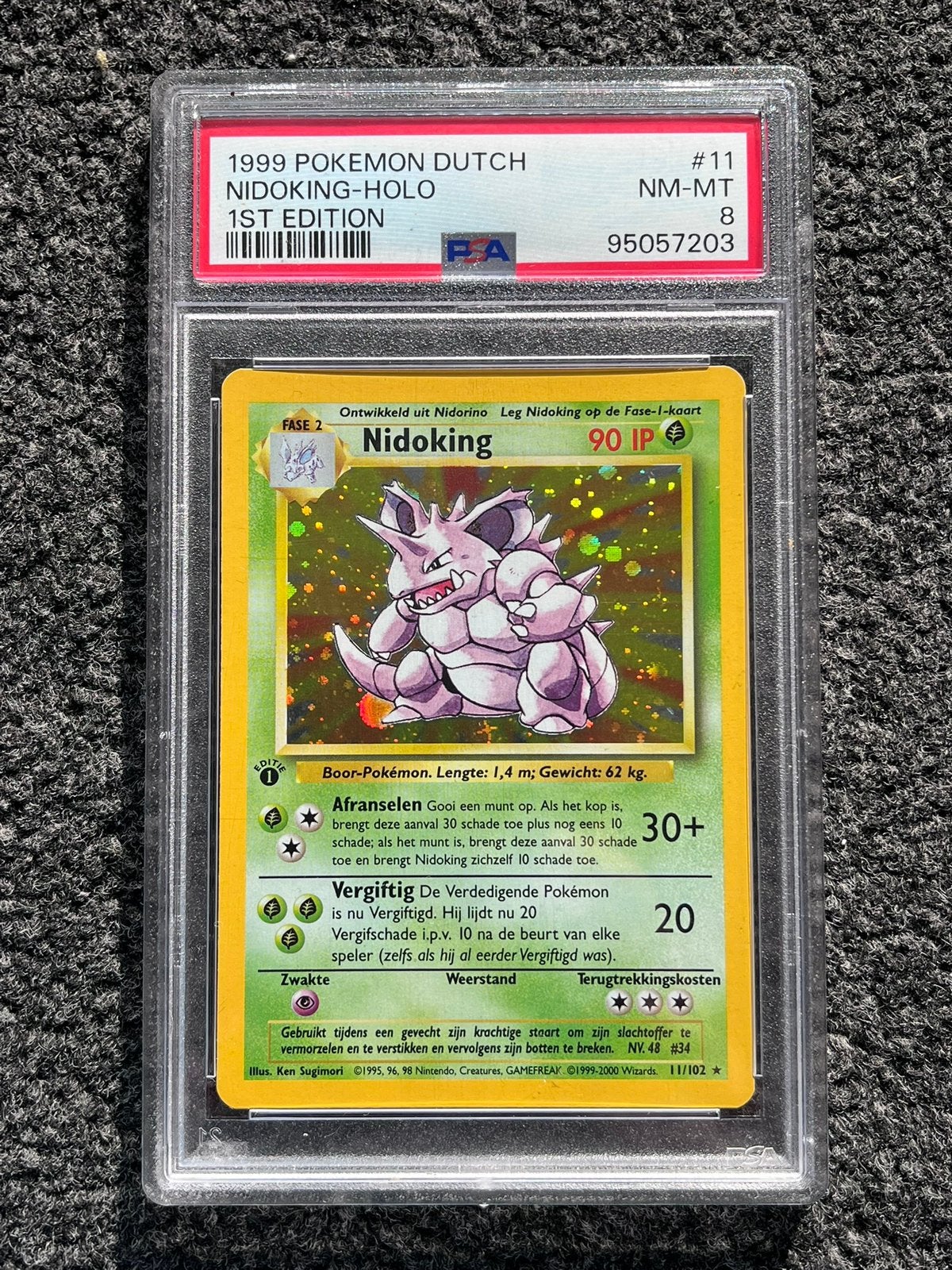 Pokémon PSA 8 1st edition Dutch Nidoking Holo #11 Base set, Ophalen of Verzenden, Zo goed als nieuw, Losse kaart, Foil