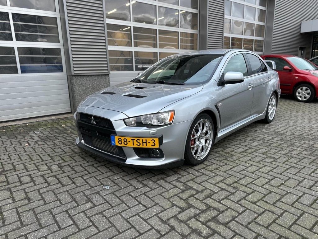 Mitsubishi Lancer 2.0 EVOLUTION X GSR 4WD NIEUWE MOTOR conco, Auto's, 1998 cc, Metallic lak, Gebruikt, Zwart