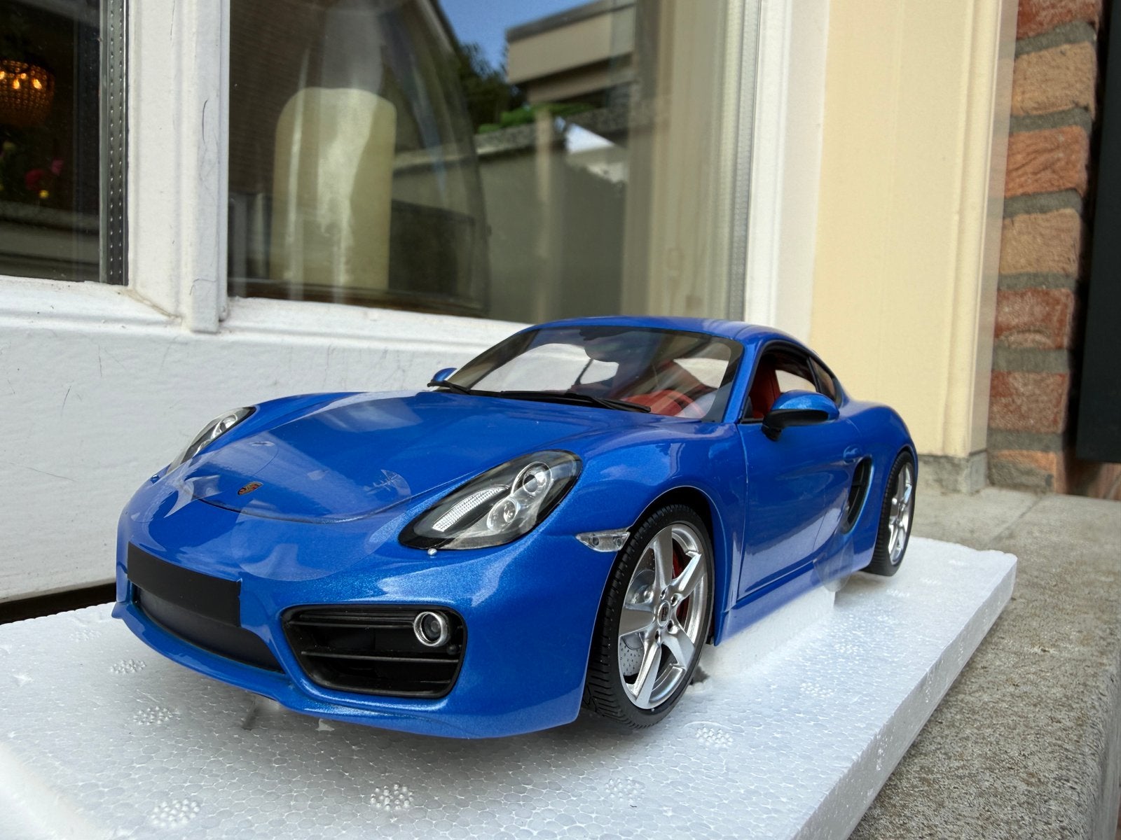 1:18 Porsche 981 Cayman blauw 2013 Minichamps, Hobby en Vrije tijd, Minichamps, Auto, Nieuw, Ophalen of Verzenden