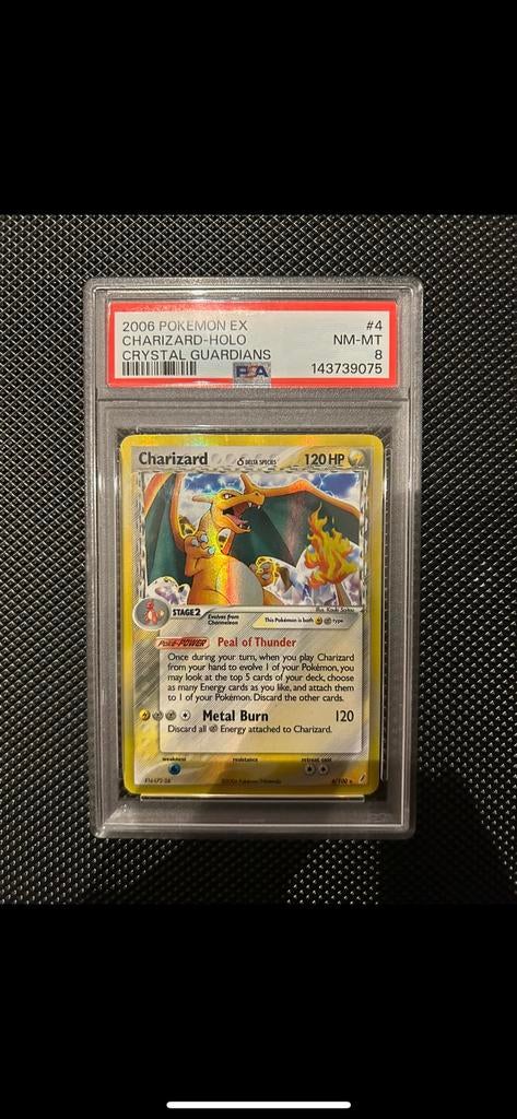 Charizard delta species 4 - PSA 8 - Pop 1003, Ophalen of Verzenden, Zo goed als nieuw