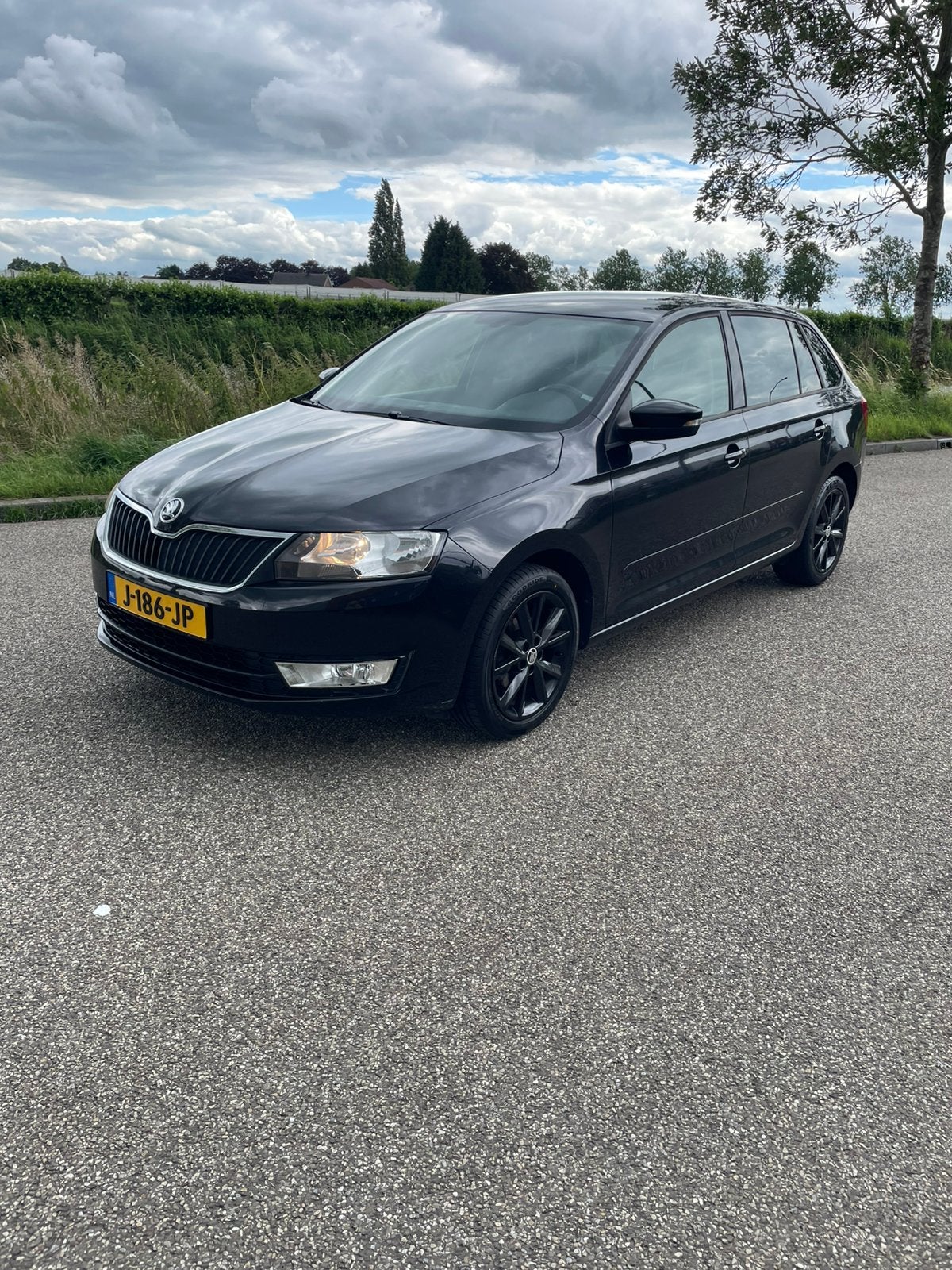 Skoda Rapid 1.2 66KW Spaceback 2016 Zwart, Auto's, Stof, Stoelverwarming, Bedrijf, Handgeschakeld