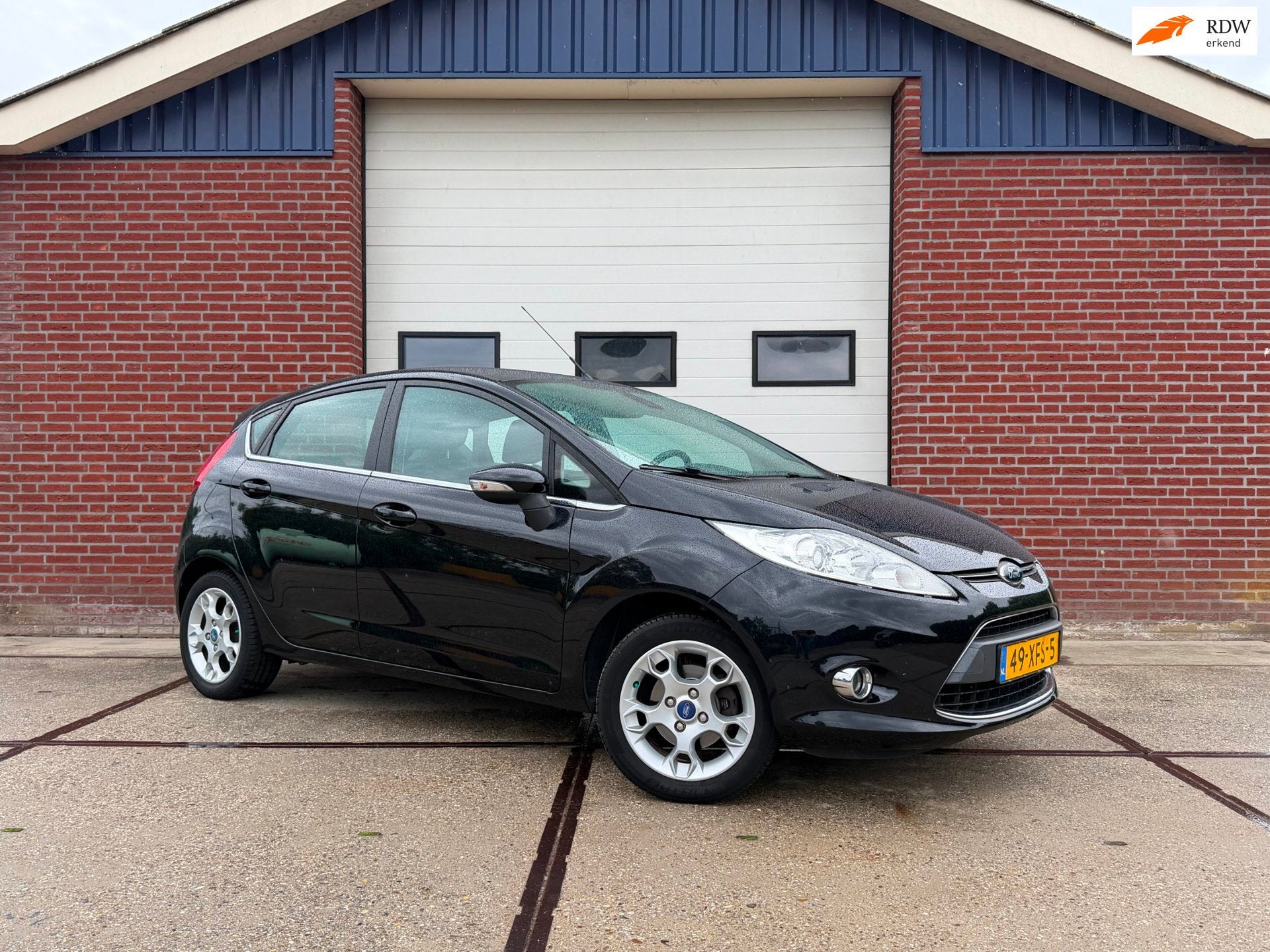 Ford Fiesta 1.25 Titanium PDC Climatew control Cruise Contro, Voorwielaandrijving, Euro 5, Stof, 82 pk