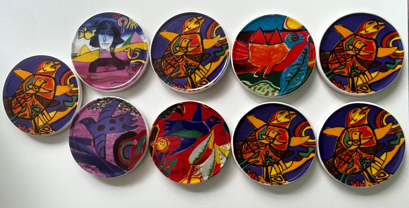 Set van 9 kleurrijke onderzetters met vogelmotieven, Ophalen of Verzenden, Glasonderzetter, Gebruikt, Meerkleurig