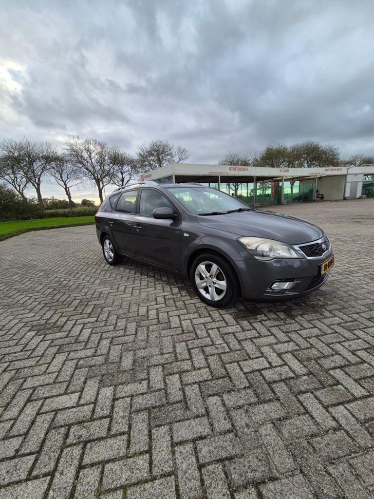 Kia (Pro) Cee d 1.4 Sporty Wagon 2010 Grijs, Auto's, Voorwielaandrijving, Stof, Zwart, 4 cilinders