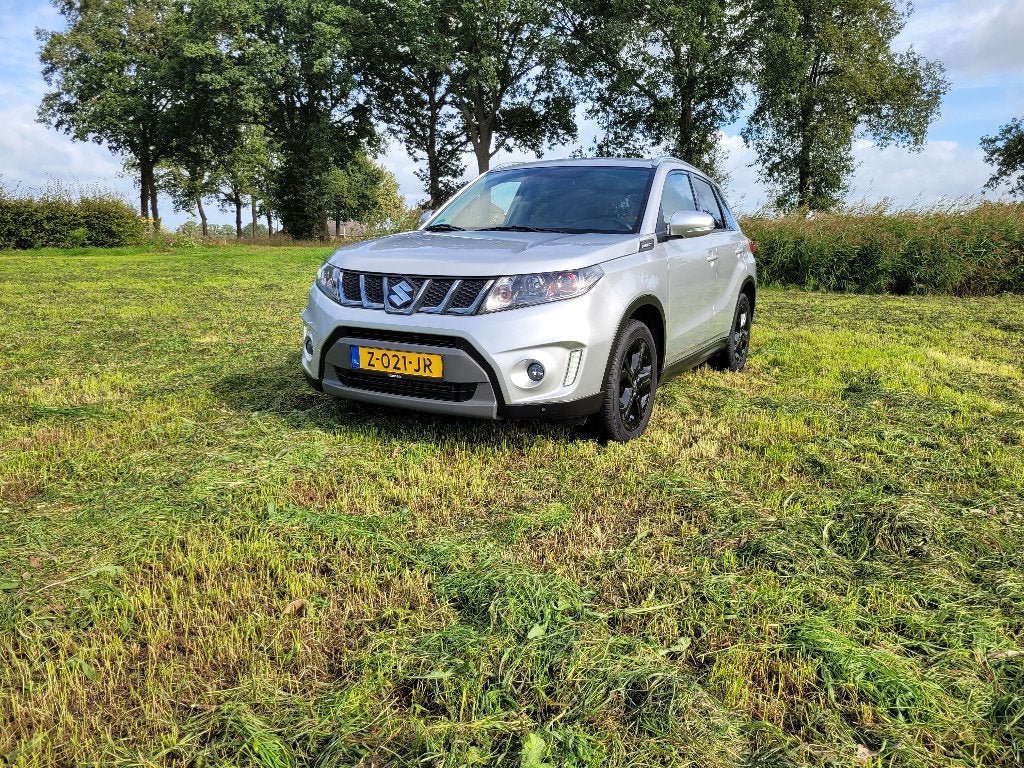 Suzuki Vitara 1.4 Boosterjet 140pk Allgrip Aut 2018 Grijs, Auto's, Automaat, Dealer onderhouden, 4 cilinders, 49 €/maand