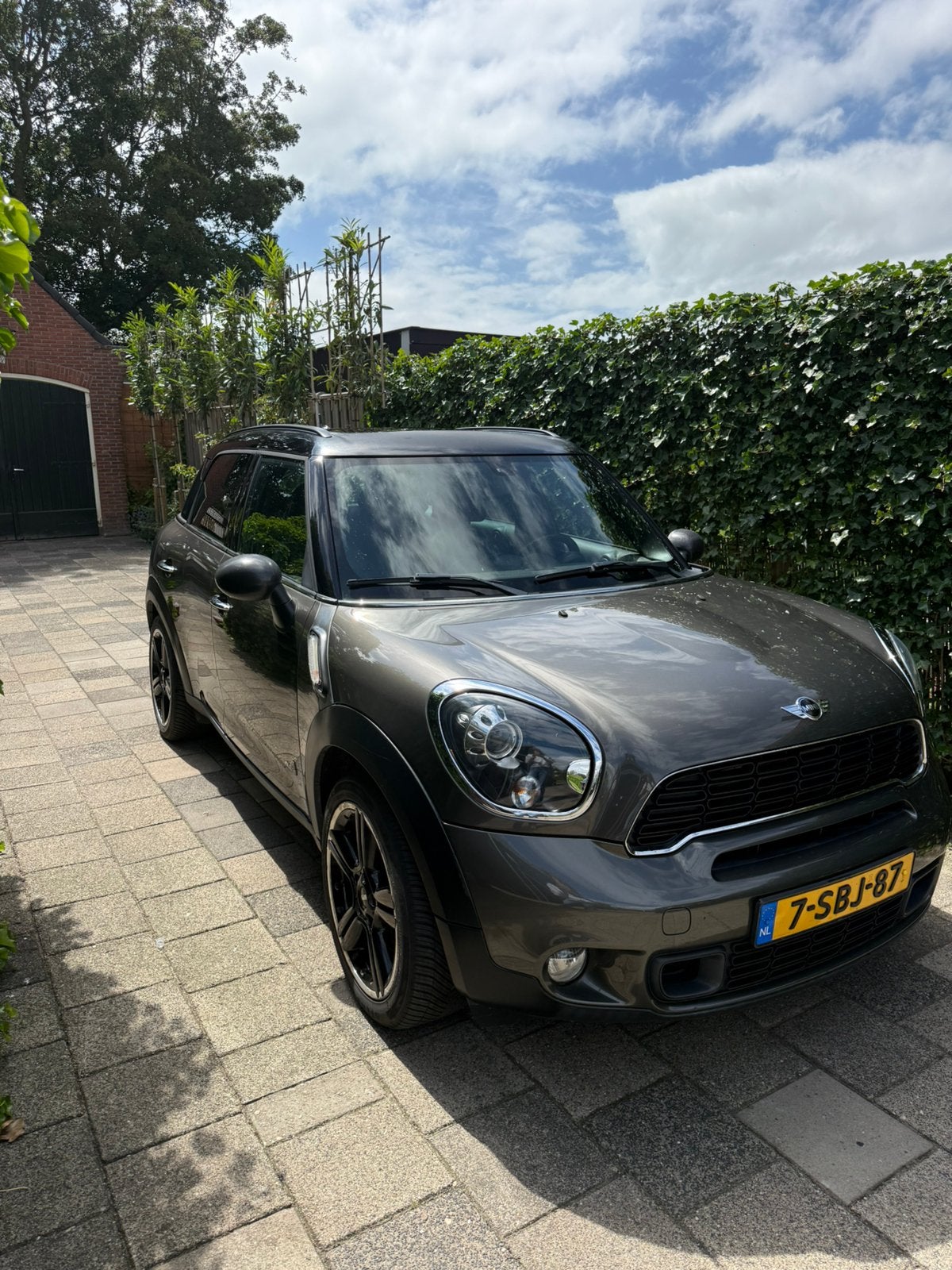 Mini Countryman 1.6 184pk All4 Aut. 2012 Grijs, Auto's, Mini, 1380 kg, Zwart, Leder, 75 €/maand