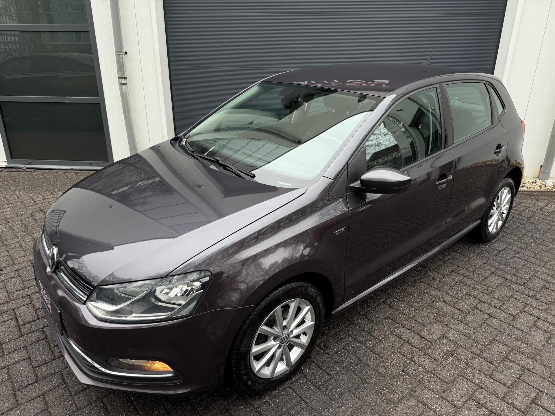 Volkswagen Polo 1.2 TSI Lounge 90 Pk DSG Cruise/Climate/Navi, Stof, Gebruikt, Zwart, Origineel Nederlands