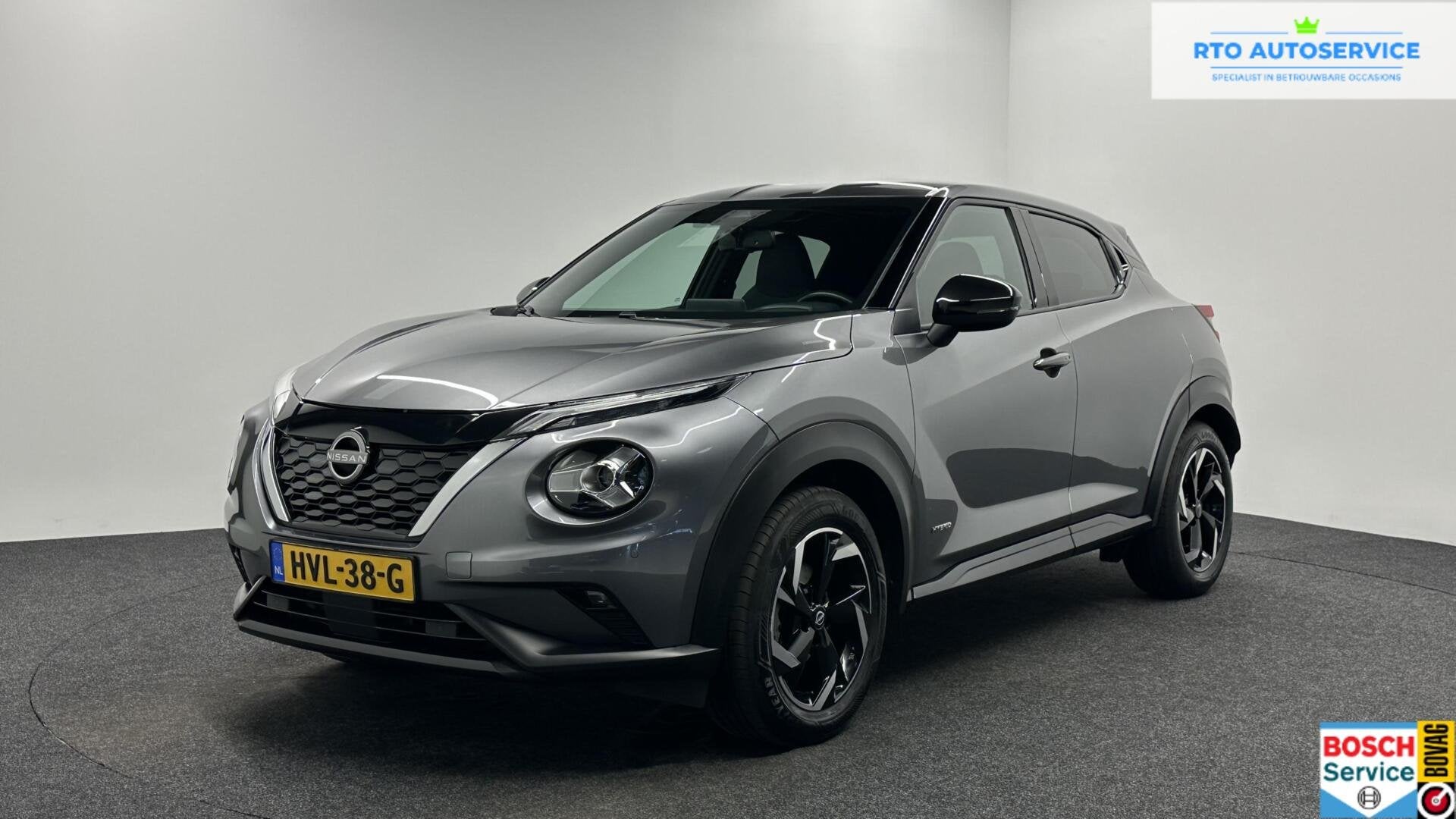 Nissan Juke 1.6 Hybrid Business Design TREKHAAK CARPLAY NAVI, Auto's, 1300 kg, Gebruikt, Met garantie (alle), Leder en Stof