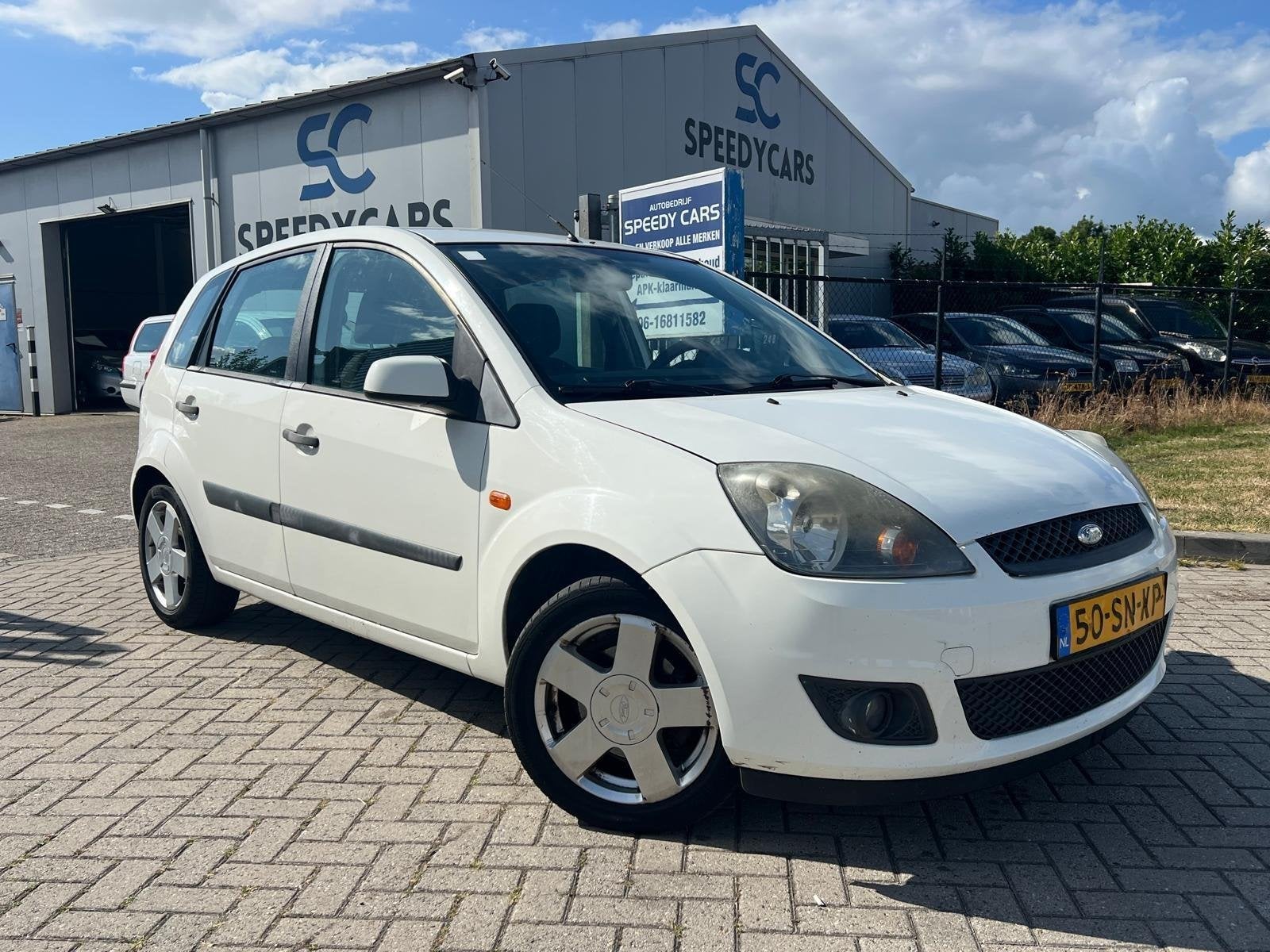 Ford Fiesta 1.4-16V Ambiente 5DRS Airco Trekhaak, Voorwielaandrijving, Elektrische ramen, Zwart, 4 cilinders