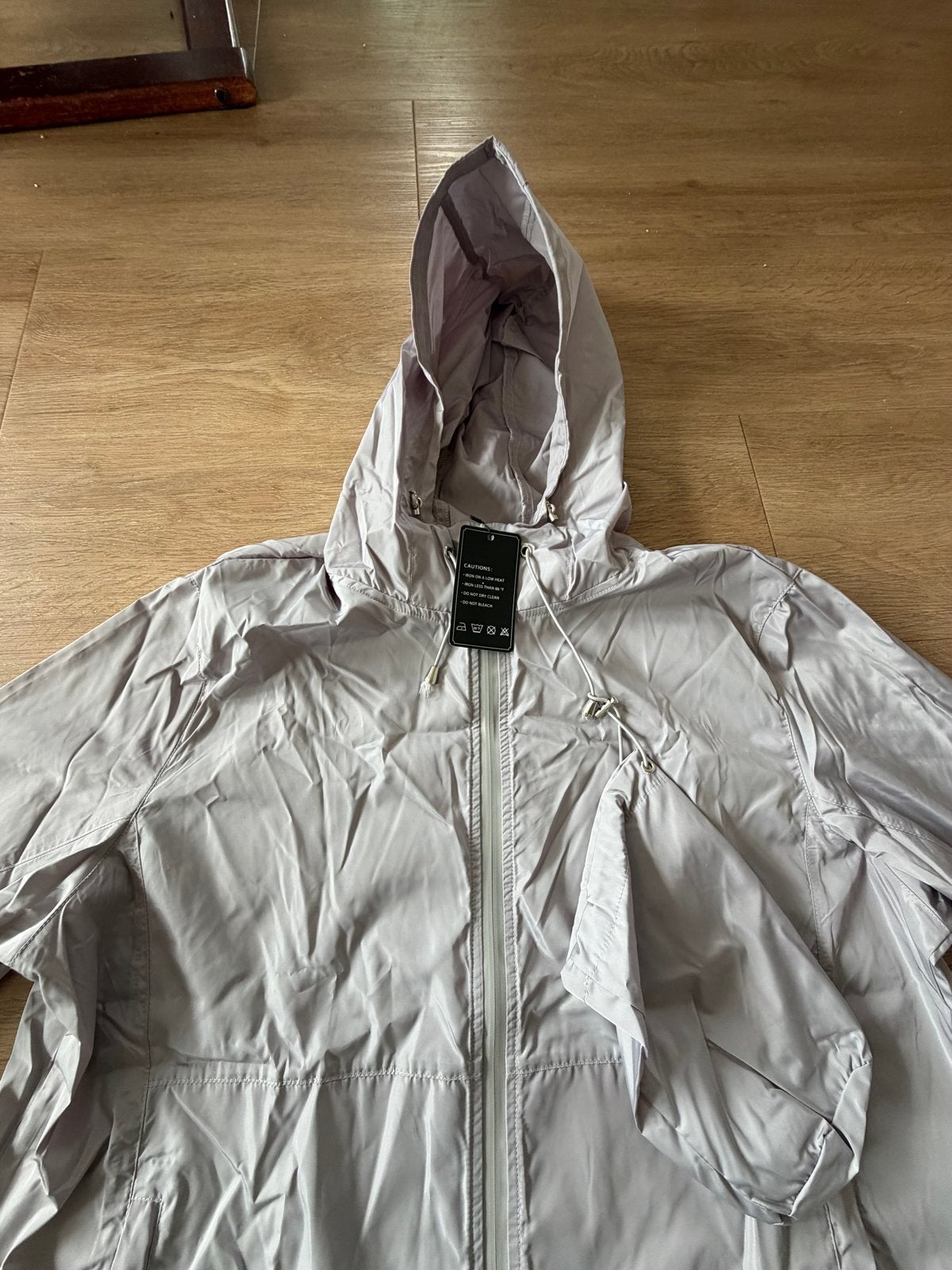Lichtgewicht regenjas met capuchon - Nieuw, Ophalen of Verzenden, Nieuw, Maat 38/40 (M), Paars