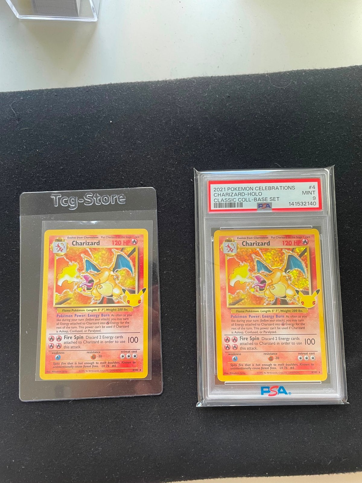 Pokémon Charizard Holo Celebrations PSA 9 & Raw, Ophalen of Verzenden, Zo goed als nieuw