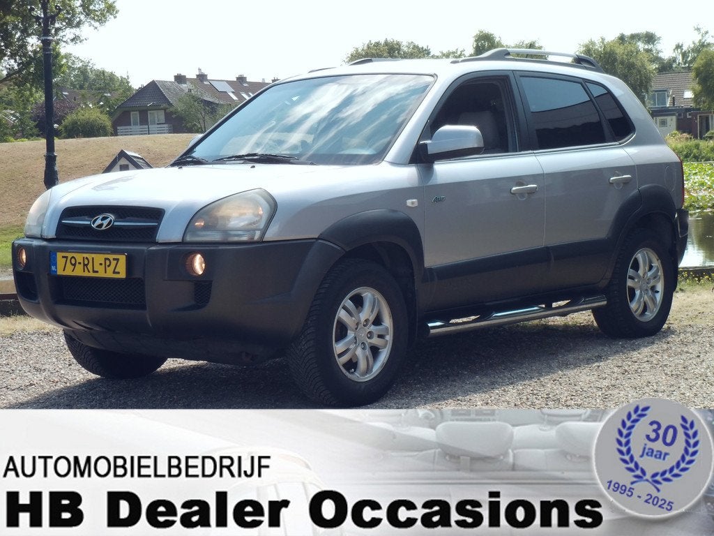 Hyundai Tucson 2.0i 4WD Style - Airco - Leer interieur, Auto's, Hyundai, Gebruikt, 4 cilinders, 4x4, Bedrijf