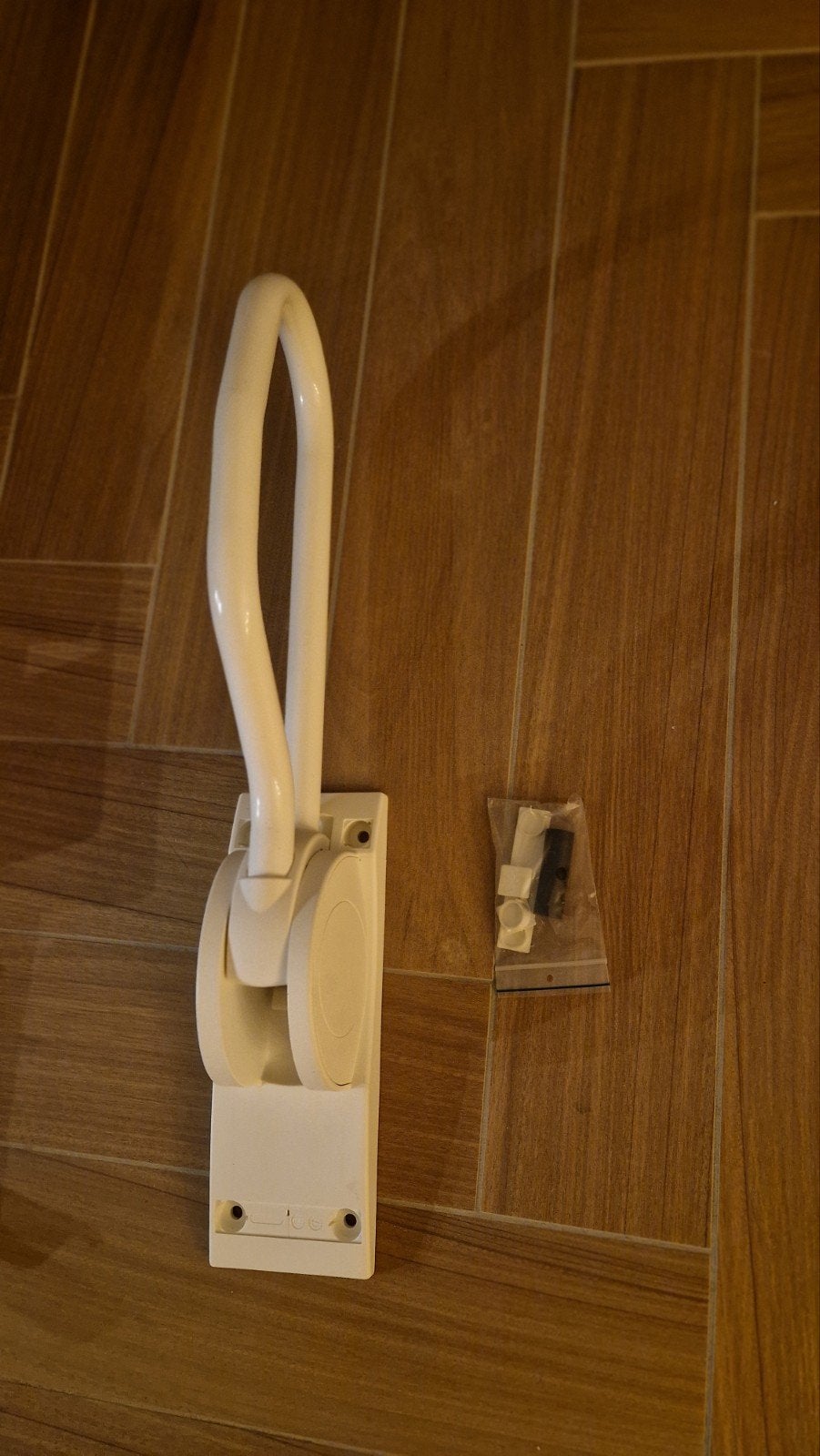 toitletbeugel inklapbaar, Ophalen
