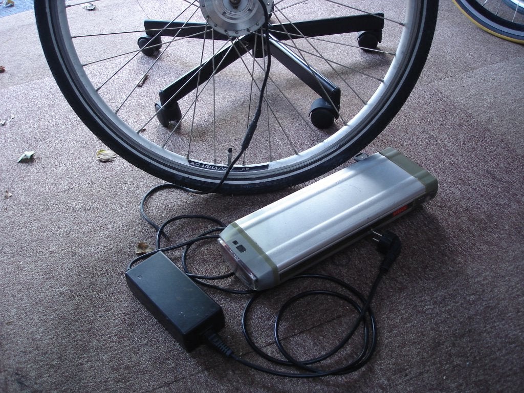 Stella 36V E-bike Accu - lader & voorwiel, Ophalen, Gebruikt