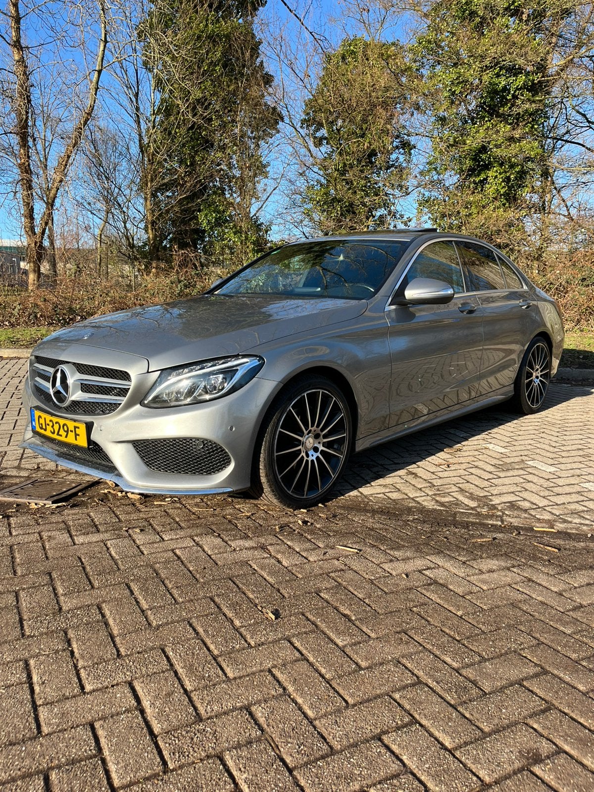 Mercedes-Benz C-Klasse AMG C200 2.0 135KW Aut7 2014 Grijs, Auto's, 1800 kg, Zwart, 4 cilinders, Parkeerassistent