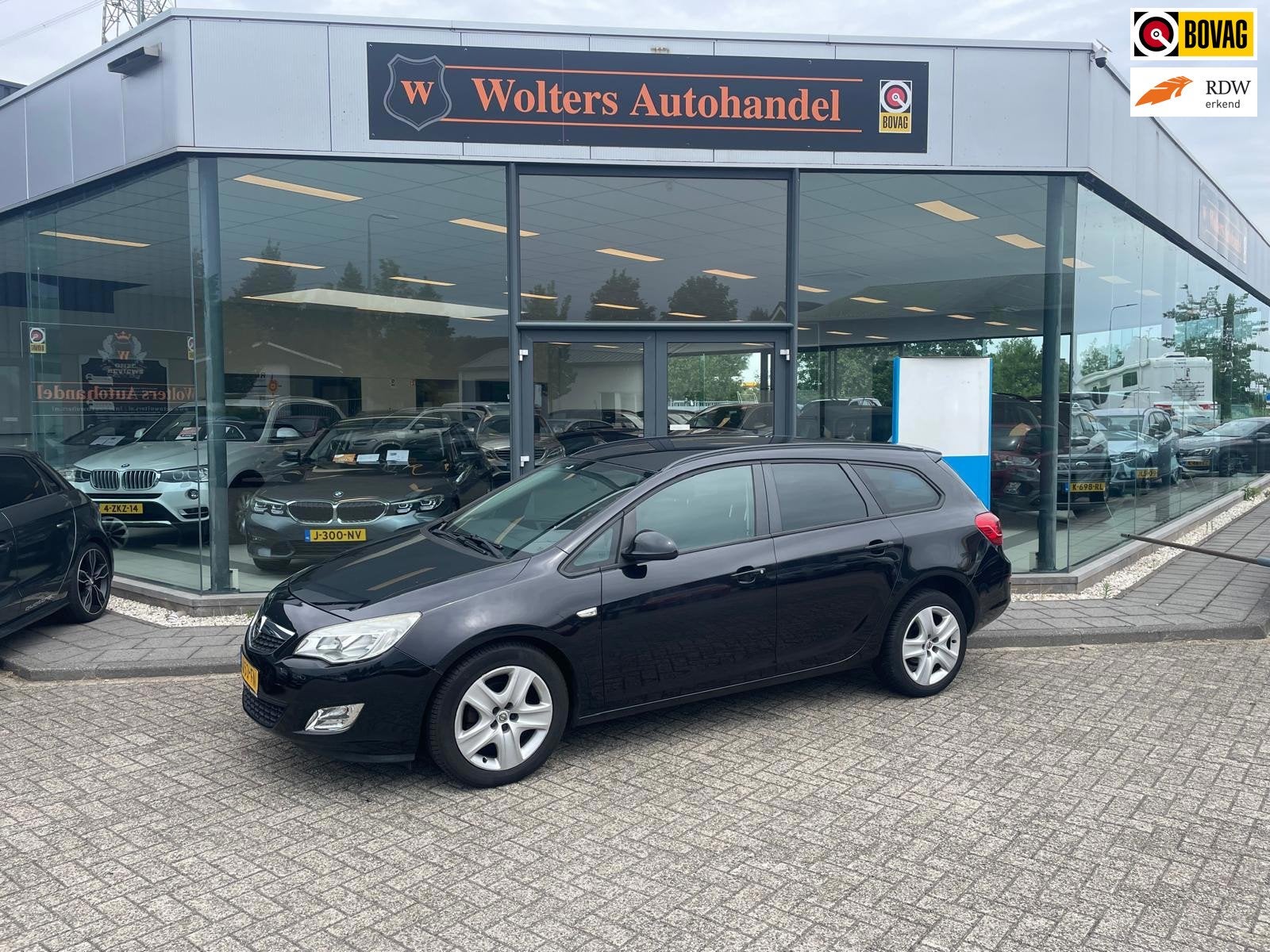 Opel Astra Sports Tourer 1.4 Turbo Cosmo, Auto's, Voorwielaandrijving, Euro 5, Stof, Gebruikt