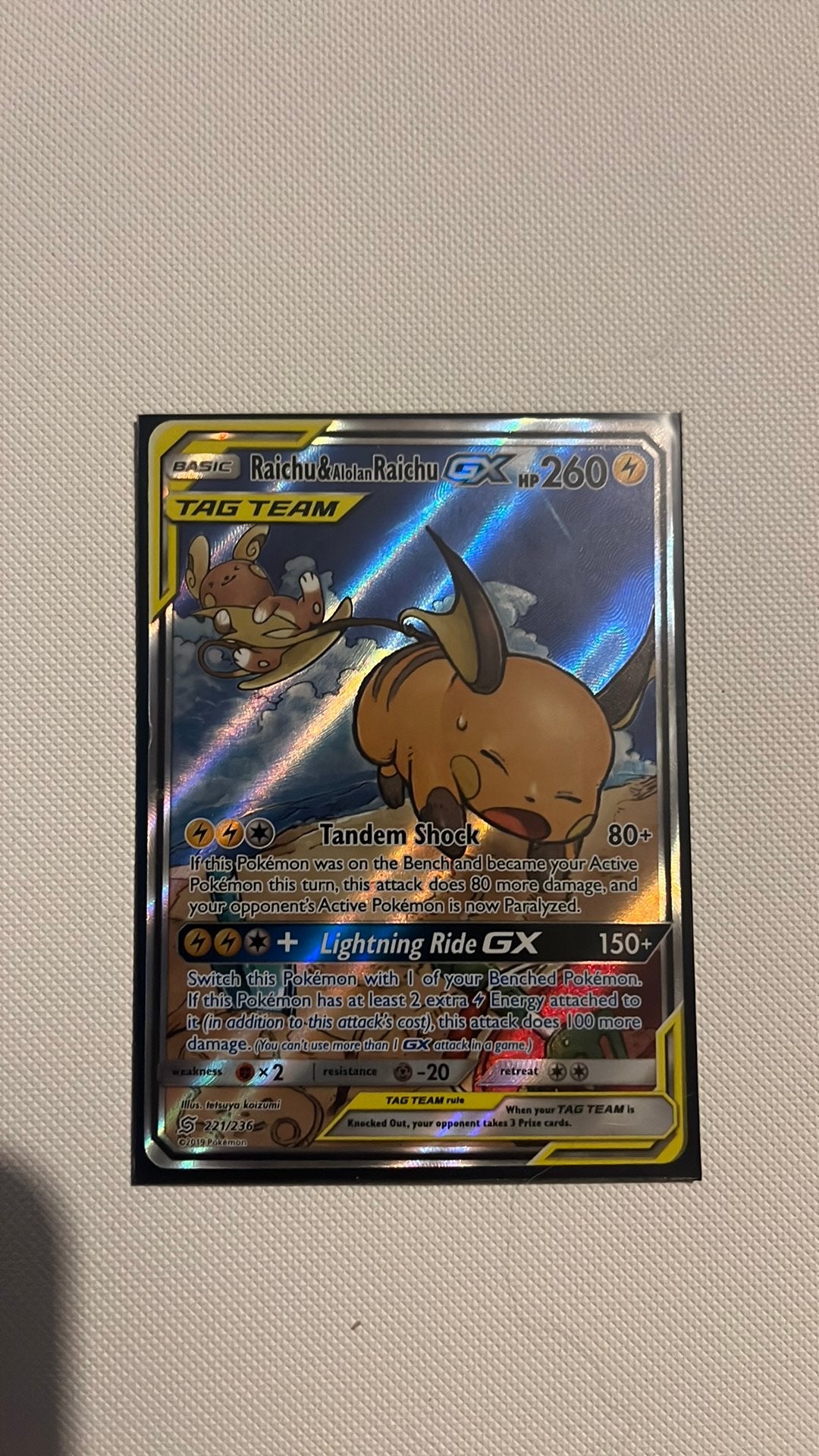 Pokemon kaart: Raichu & Alolan Raichu TAG TEAM GX (221/236), Ophalen of Verzenden, Gebruikt, Losse kaart, Foil