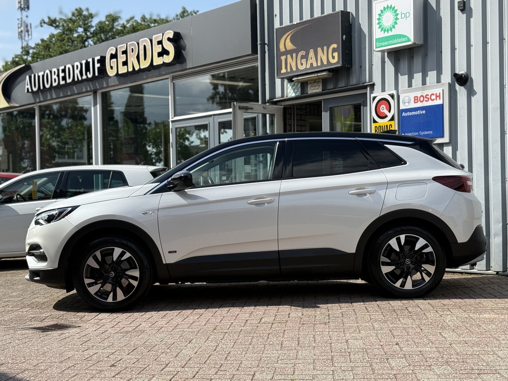 Opel Grandland X 1.6 Turbo Hybrid Business Elegance 181pk |, Auto's, Dealer onderhouden, 4 cilinders, Leder en Stof, Wit