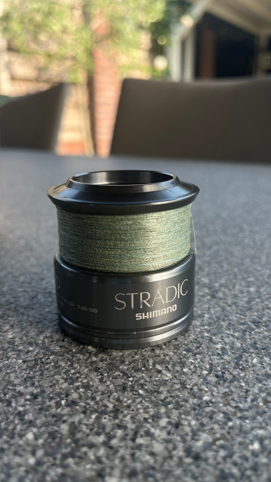 Shimano Stradic 4000FD spoel met gevlochten draad, Ophalen of Verzenden, Zo goed als nieuw, Molen