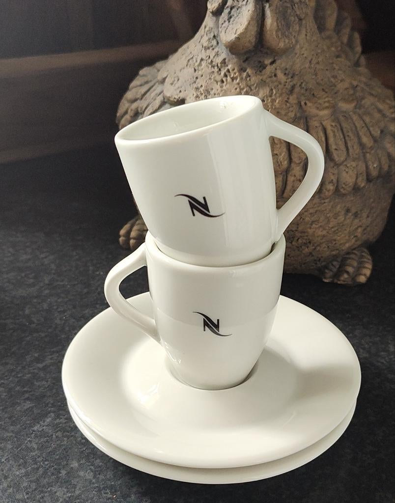 2x Nespresso (espresso) kop en schotels, Ophalen of Verzenden, Zo goed als nieuw, Porselein, Kop en/of schotel