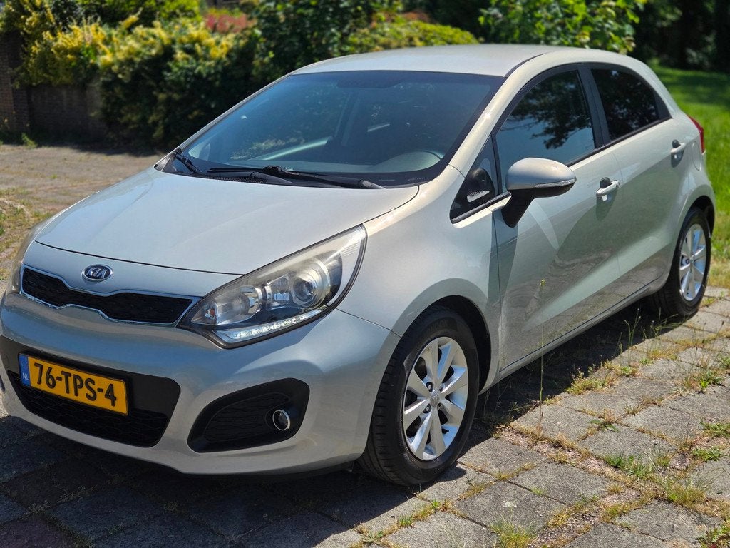 Kia Rio 1.2 CVVT Super Pack, Auto's, Euro 5, 4 cilinders, Automatische klimaatregeling, Beige