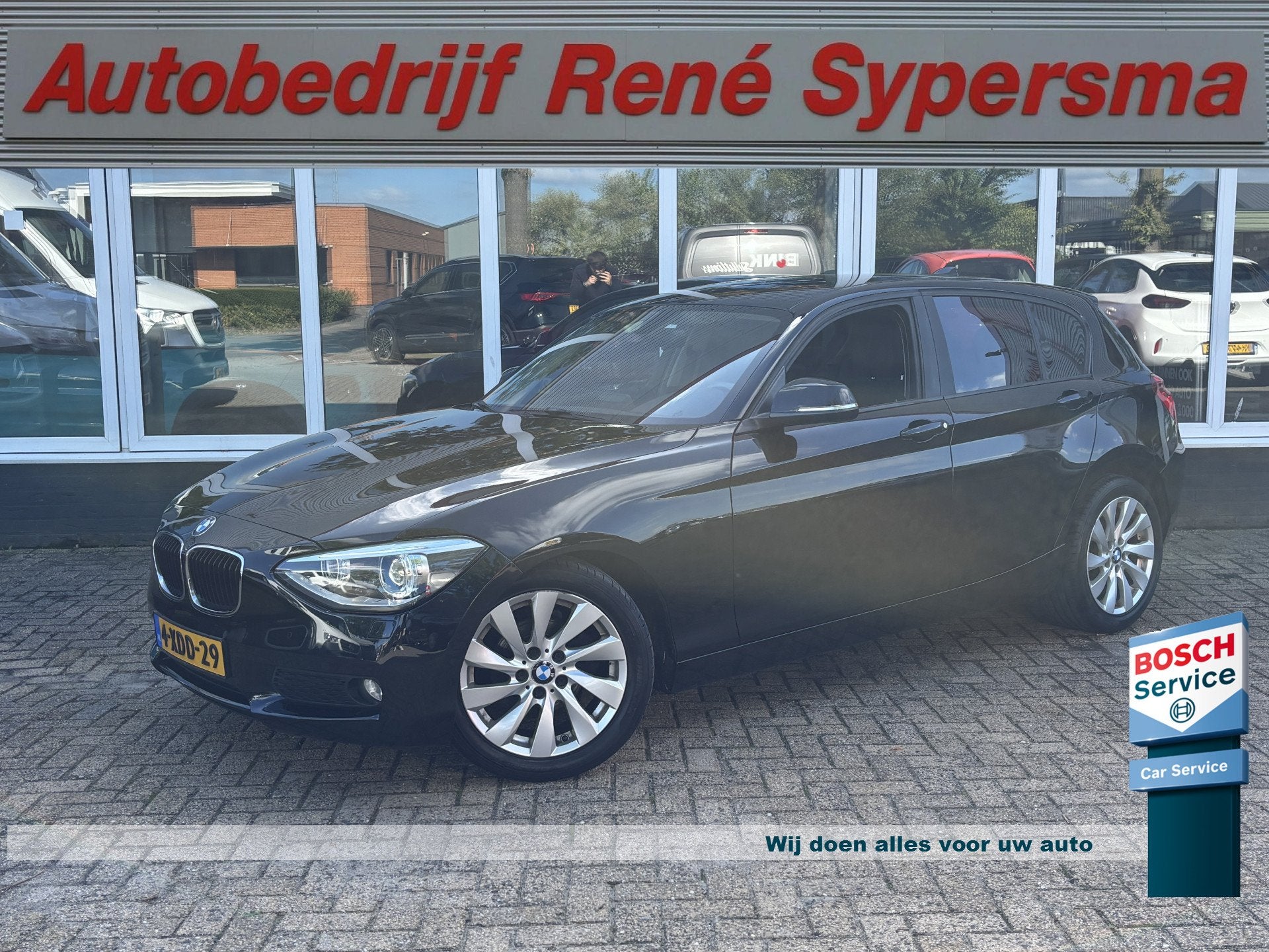 BMW 1-serie 114i EDE | Stoelverwarming | Leder | Bluetooth |, 1-Serie, Achterwielaandrijving, Gebruikt, Zwart