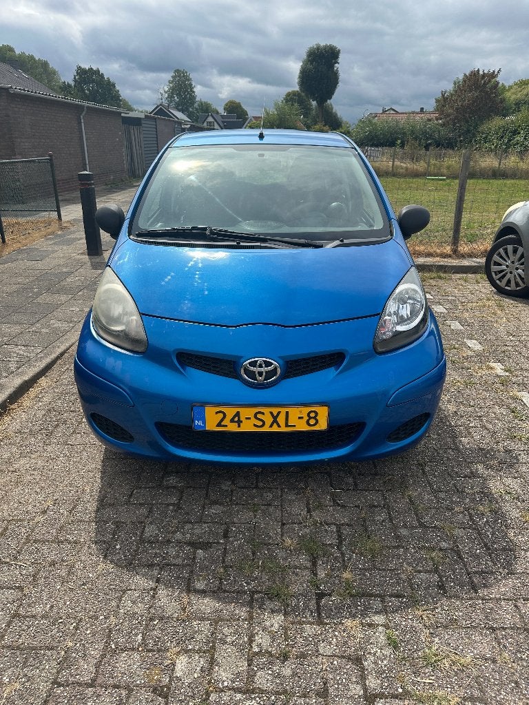 Toyota Aygo 1.0 12V Vvt-i 5DRS 2011 Blauw, Auto's, Toyota, Voorwielaandrijving, Zwart, 68 pk, Origineel Nederlands