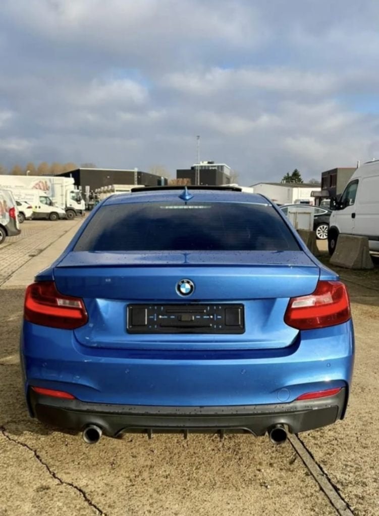 BMW m235i - 50k km 2016 US import, Auto's, Automaat, Achterwielaandrijving, Zwart, Blauw